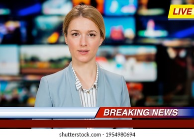 An Anchorwoman Reporting Live Breaking News Sitting In Tv Studio. Background Of Multiple Screens Of Broadcast Control Room. Journalism Concept