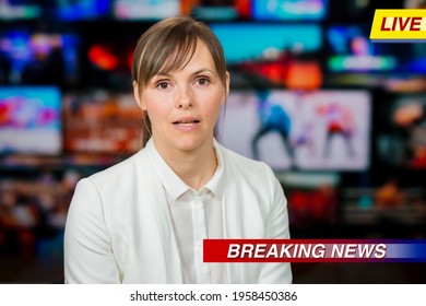 An Anchorwoman Reporting Live Breaking News Sitting In Tv Studio. Background Of Multiple Screens Of Broadcast Control Room. Journalism Concept