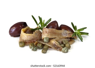 Anchovy Fillets With Baby Capers, Pitted Black Olives, And Rosemary, Isolated On White.