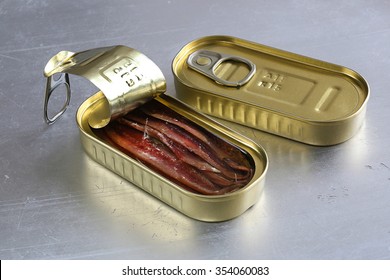 Anchovy In An Opened Tin Can On Metal, With A Fork