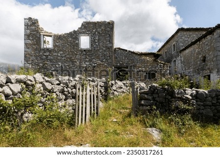 Ancient abandoned house complex, stony aged architecture
