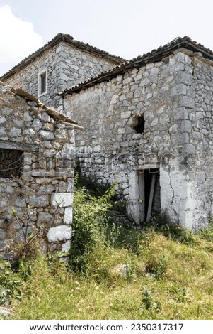 Ancient abandoned house complex, stony aged architecture
