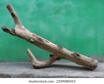 Ancient aesthetic abstract contemporary sculpture using wood material on a green background - Powered by Shutterstock