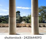 The Ancient Agora in Athens, Greece, as seen from inside the Stoa of Attalus. The temple of Hephaestus can also be seen in the distance.