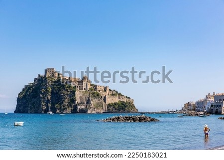 Ancient Aragon Castle on the Island Of Ischia (Castello Aragonese d'Ischia) on a cliff in the Mediterrenian Sea in Italy against a blue sky