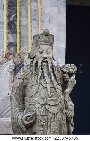 Ancient architecture antique chinese ballast doll stone statue at Wat Pho Bang O temple for thai people foreign travelers travel visit and respect praying blessing holy worship in Nonthaburi, Thailand