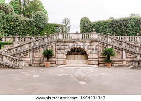 Ancient architecture of Italy. Old steps in the large garden of the European castle