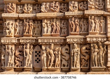 Ancient bas-relief at famous erotic Kandariya Mahadev temple in Khajuraho, India. Most Khajuraho temples were built between 950 and 1050 by the Chandela dynasty.