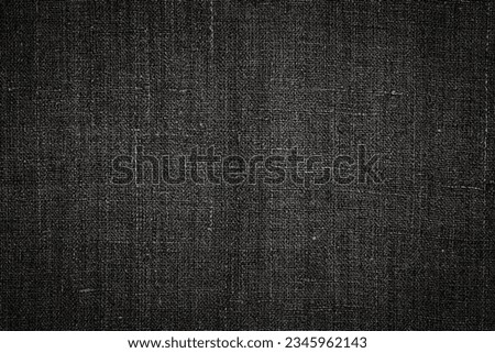 Ancient black linen cloth, close up macro. Pure black linen texture. Old hemp burlap fabric, closeup