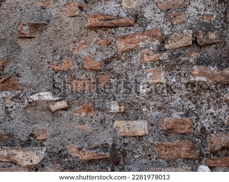 Ancient brick wall background. Colosseo vintage wall. Texture of old amphitheater stone useful for design