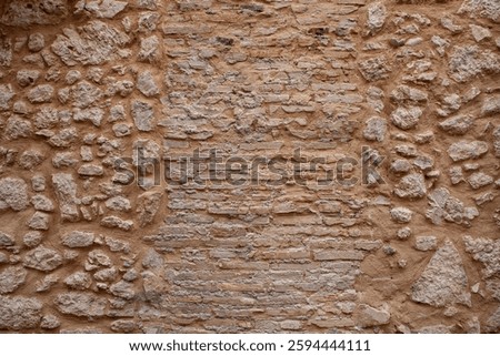 An ancient brick wall in the old mountain village of Castel del Monte, Abruzzo, Italy