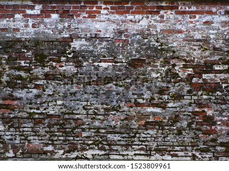 Ancient brick wall. Out of focus. The colors are varied.