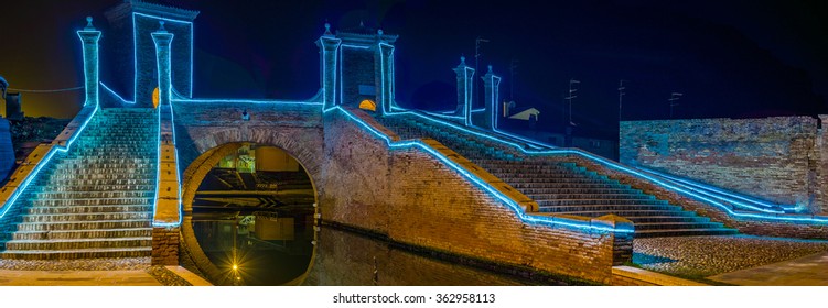 Ancient Bridge At Night Lit By Christmas Lights In Comacchio, The Little Venice, In Italy