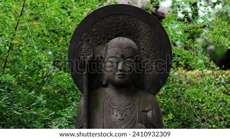 An ancient bronze statue of a healing deity. Gokoku-ji Buddhist Temple. Bunkyo-ku, Tokyo, Japan.