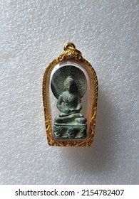 Ancient Buddha Statue In The Gold Amulet Frame