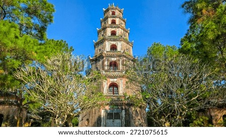 Ancient Buddhist Stupa and Stone Pillars in the Pine Forest Garden of Thien Mu Pagoda, Hue, Vietnam