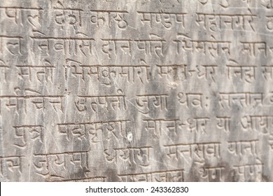 An Ancient Buddhist Text In Sanskrit Etched Into A Stone Tablet.