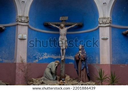 Ancient Calvary with the powerful and iconic representation of the death and crucifixion of Christ and the robbers. Polychrome statues Latin inscription INRI for 