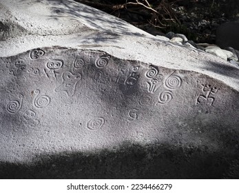 Ancient carved stone boulder, Taino Indians symbols figures, The Written Stone or La Piedra Escrita in Jayuya Puerto Rico