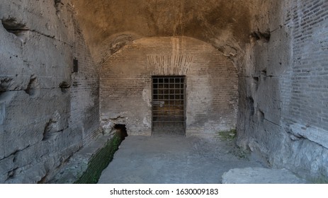 ancient cave or dungeon with a cell with bars for prisoners