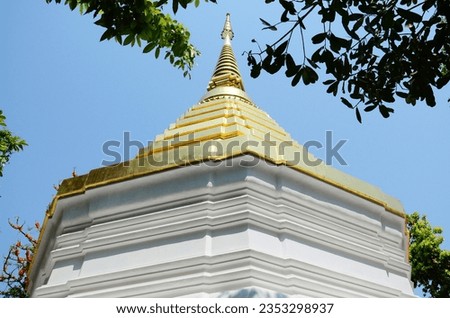Ancient chedi or antique old stupa for thai people travelers travel visit and respect praying blessing wish holy mystery of Wat Phra Kaew or Pa Ya or Pa Yea temple at Chiangrai in Chiang Rai, Thailand