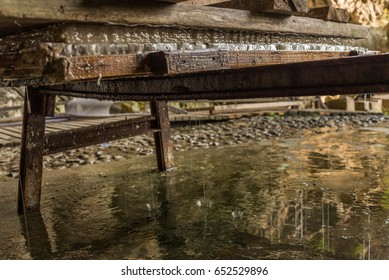 Ancient Chinese Paper Making Process. Water Is Squeezed Out Of The Paper In A Local Cave In Dan'zhai, A Miao Ethnic Group Village Specializing In Handmade Paper Tracing Back To Tang Dynasty.