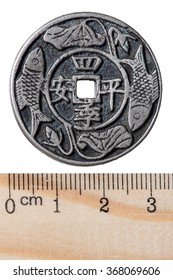 Ancient Chinese Silver Coin With A Square Hole. Qin Dynasty. Obverse. Isolated On White