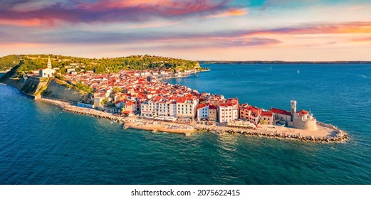 Сharm of the ancient cities of Europe. Bright morning cityscape of Piran town. Stunning summer scene of Slovenia’s Adriatic coast with beautiful Venetian architecture. View from flying drone.