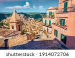 Сharm of the ancient cities of Europe. Sunny spring cityscape of Ragusa town with Church of St Mary of the Stairs on background. Wonderfulmorning scene of Sicily, Italy, Europe. 