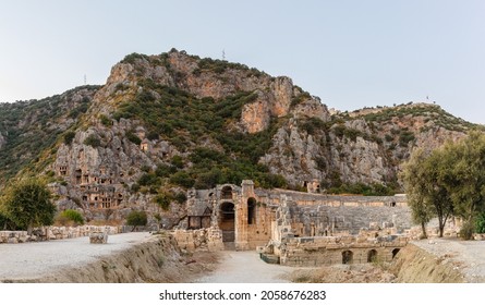 The ancient city of Mira is the capital of the Lycian state. Greco-Roman amphitheater and Lycian rock tombs. Demre city. Turkey. Evening photo. Panorama. Without people.