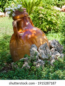 Ancient Clay Container For Storing Oil Used To Furnish A Garden In The Puglia Countryside