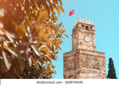Ancient Clock Tower building in Antalya tourist resort. Architecture and travel destinations in Turkey