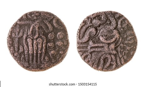 An Ancient Copper Tamil Coin Of The Chola Dynasty. Isolated On White