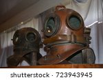Ancient diving brass helmet equipment with air supply ship. Copper old vintage deep sea diving suit. two heavy Retro diving helmet in museum. 