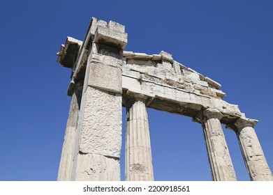 Ancient Doric order columns of the Gate of Athena Archegetis a historic landmark on the grounds of the Hellenistic and Roman Agora of Athens, Greece.
