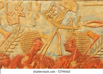 The Ancient Egyptian Army. A Standard Bearer Turns And Talks To A Fellow Axeman