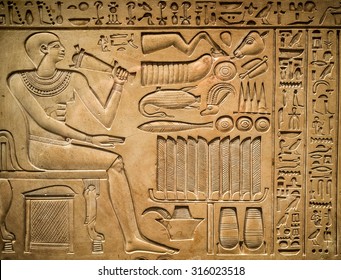 Ancient egyptian hieroglyph depicting a pharaoh, animals and signs - Shutterstock ID 316023518