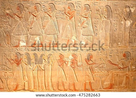 Ancient Egyptian hieroglyphics, stone carving reliefs with elegant women, historic Egypt