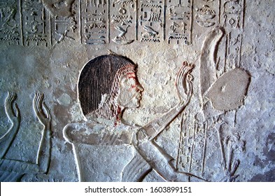 Ancient egyptian wall paintings and hieroglyphics. Aye and his wife, Tiya, at the entrance to their tomb. Tomb of Ay the high priest of Aton during Akhenaton, Amarna