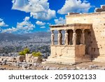 Ancient Erechtheion or Erechtheum temple with Caryatid Porch on the Acropolis, Athens, Greece. World famous landmark at the Acropolis Hill