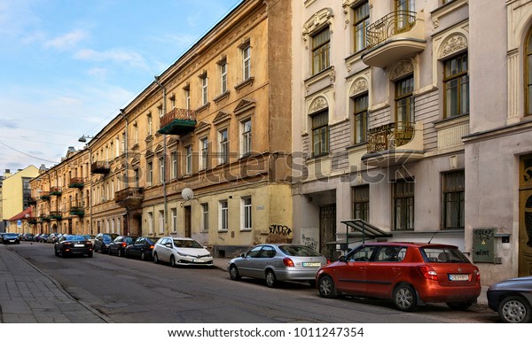 Ancient European town. Cars on Vilnius\
streets. Old city. Wonderful image of ancient architecture of\
Baltic countries. Lithuania, Vilnius - April 27,\
2017
