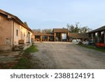 Ancient farmhouse ruin columns roof bricks uninhabited agriculture characteristic Po Valley Italy Italian panorama landscape vision detail natural nature