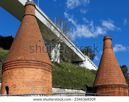 Ancient furnaces with chimneys in brick, from the beginning of the twentieth century, belonging to a disabled ceramic factory , located beneath the new railway bridge of St. John. Oporto industrial ar
