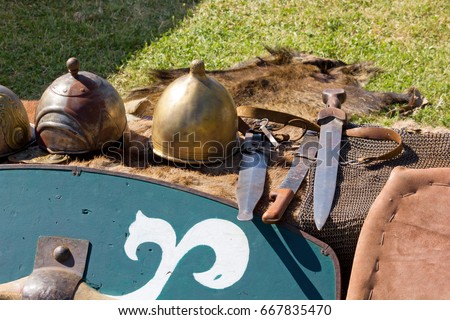 Ancient gallic helmets, shield and daggers at a historical reenactment