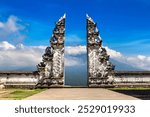 Ancient gate at Pura Penataran Agung Lempuyang temple and volcano Agung on Bali, Indonesia in a sunny day