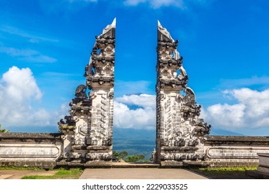Ancient gate at Pura Penataran Agung Lempuyang temple and volcano Agung on Bali, Indonesia in a sunny day
