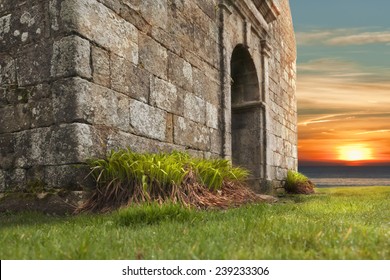 Ancient Gaul Church Entrance In Sunset, France 