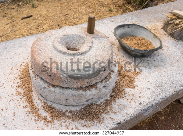 Ancient grain hand\
grinding millstones.