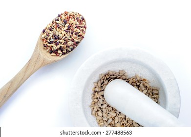 Ancient Grains In Mortar And Pestle And Wooden Spoon