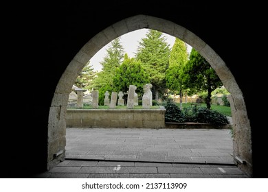 Ancient Graveyard, Ottoman Governments Tombstone By Taking Photo Behind Arch Structural Building And Column